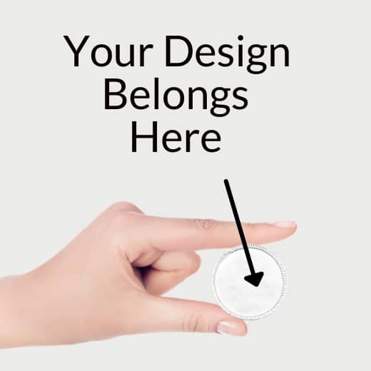 A hand holding a blank patch that says Your Design Belongs Here.